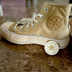 Women’s pair of Lifted Chuck Taylor’s, Size 7. In like new condition!